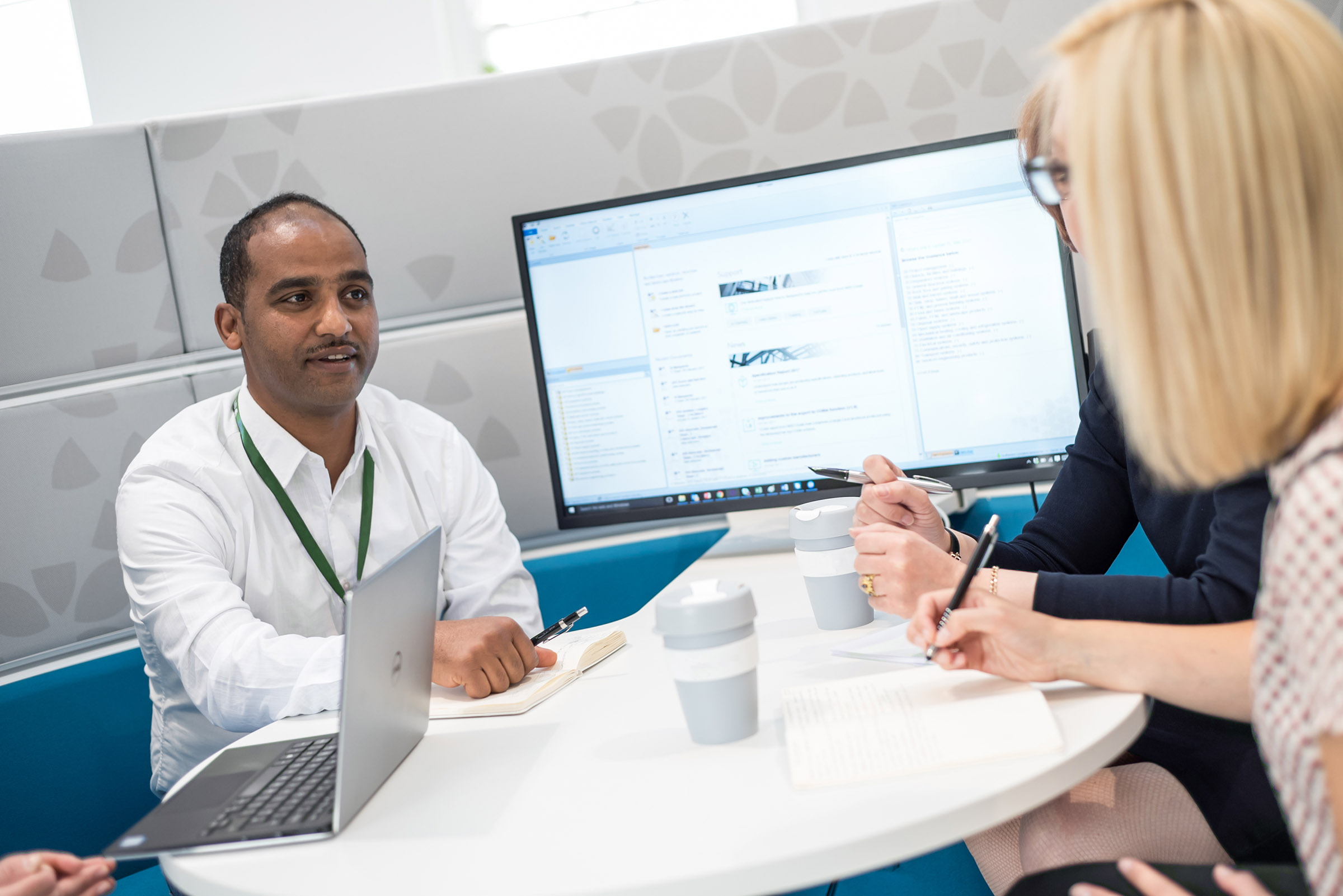 account manager and client having a meeting at a desk