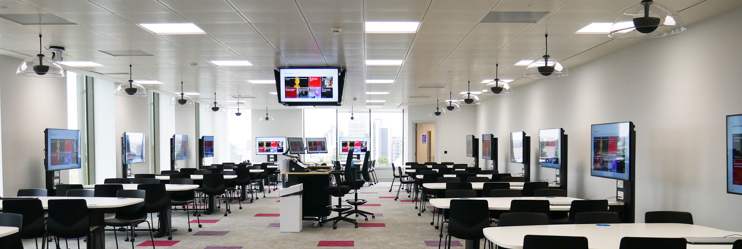 Microphones, screens and desks in a learning environment providing audio solutions
