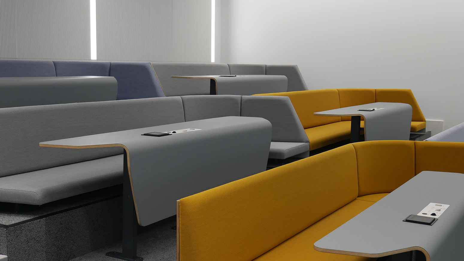 rows of lecture theatre seating modern desks