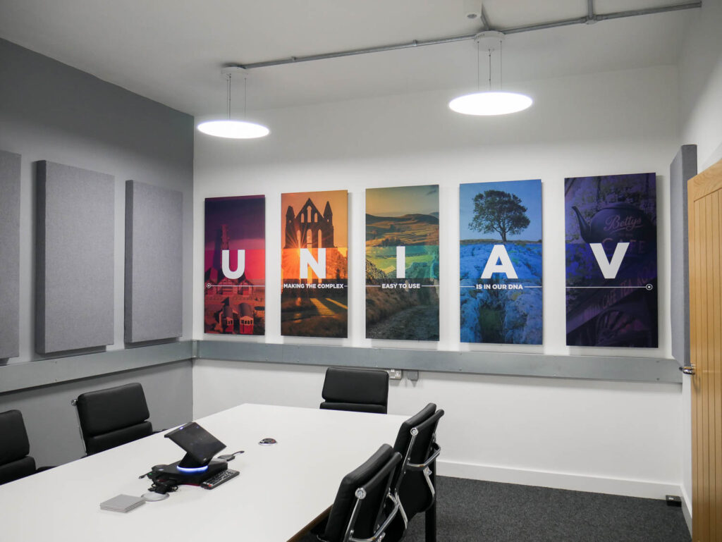 Bespoke acoustic panels on the wall of a meeting room at Universal AV Services